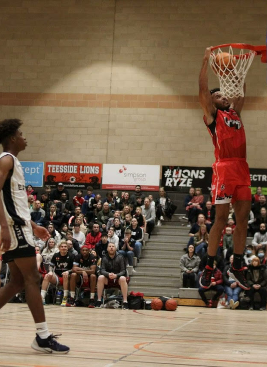 Ross Wilson dunks in the home fixture against Newcastle Eagles